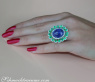 Opulent Tanzanite Ring with Diamonds and Emeralds