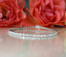 Exquisites Tennis Armband mit Diamanten im Smaragdschliff