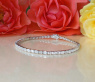 Exquisites Tennis Armband mit Diamanten im Smaragdschliff