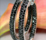 Oval hoop earrings with black diamonds