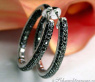 Oval hoop earrings with black diamonds