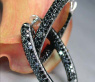 Oval hoop earrings with black diamonds