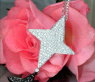 Extravagant Black & White Diamond Star Pendant