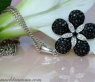 Radiant Black & White Diamond Flower Pendant