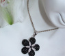 Radiant Black & White Diamond Flower Pendant