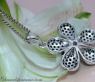 Radiant Black & White Diamond Flower Pendant