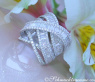 Überkreuzter Brillanten Ring mit Baguette Diamanten