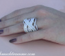 Überkreuzter Brillanten Ring mit Baguette Diamanten