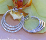 Interesting three row diamond hoop earrings